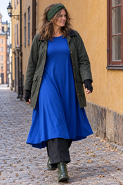 Klarblå Ballerina med öppen grön oljerock