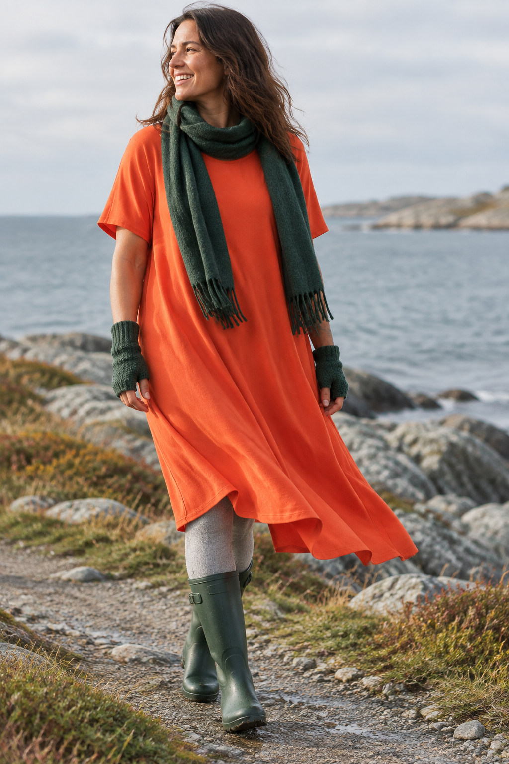 Orange Ballerina i rörelse vid kusten